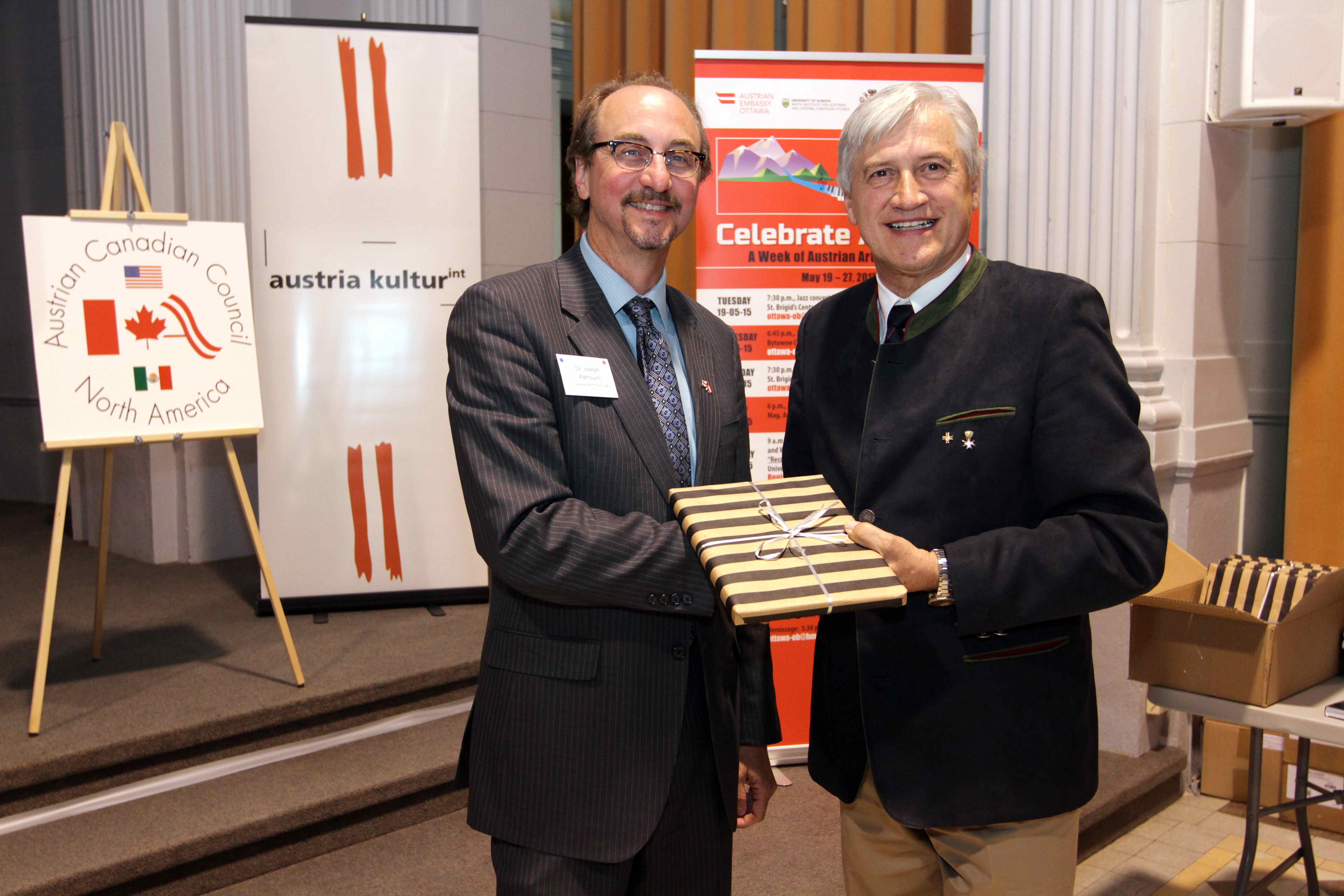 ACC Pres. Pirker presents Dr. Patrouch with a copy of the Anniversary Book ACC Pres. Pirker presents Dr. Patrouch with a copy of the Anniversary Book